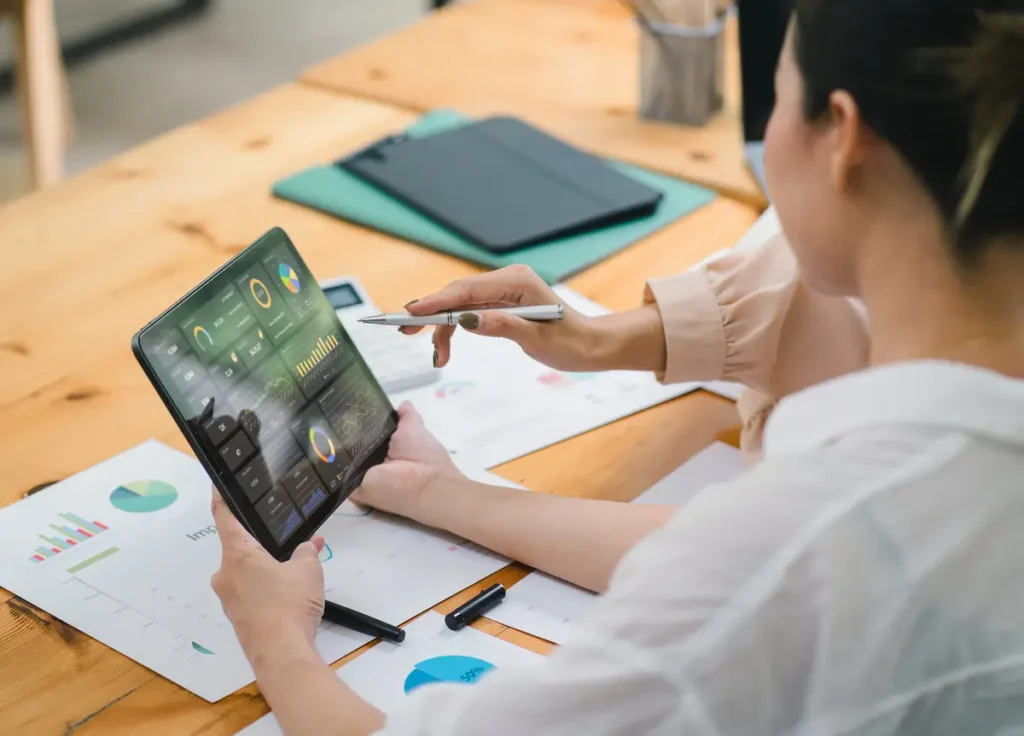 viewing a tablet with AEO and GEO